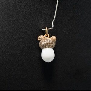 Antique fabrege egg pendent in 14 k gold .